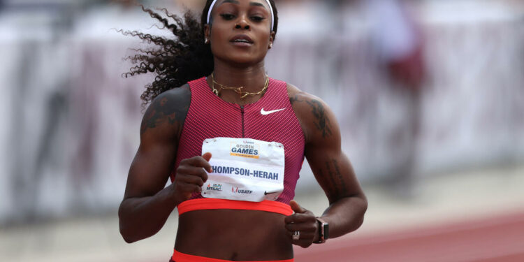 WALNUT, CALIFORNIA - APRIL 16: Elaine Thompson-Herah of Jamaica crosses the finish line of the women's 100 meter dash semi-finals during the Mt SAC Relays Elite Division & USATF Golden Games at Hilmer Lodge Stadium on April 16, 2022 in Walnut, California. (Photo by Katharine Lotze/Getty Images)