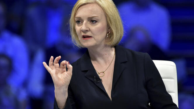 Liz Truss addresses Conservative Party members during a Conservative leadership election hustings at the NEC, Birmingham, England, Tuesday, Aug. 23, 2022. (AP Photo/Rui Vieira)