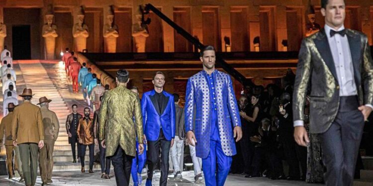Models present creations by Italy's iconic fashion house Stefano Ricci at the temple of the Ancient Egyptian Pharaoh Hatshepsut on the west bank of the Nile river, off Egypt's southern city of Luxor, on October 9, 2022. (Photo by Khaled DESOUKI / AFP) (Photo by KHALED DESOUKI/AFP via Getty Images)