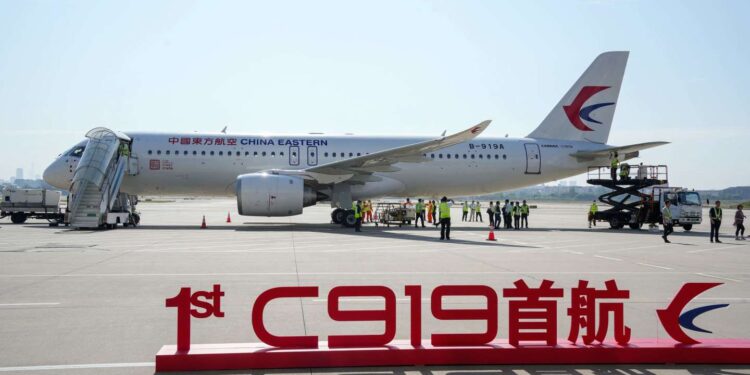 China's first domestically produced passenger jet C919 sits on the tarmac before its first commercial flight from Shanghai to Beijing, in Shanghai Hongqiao Airport on May 28, 2023. China's first domestically produced passenger jet took off on its maiden commercial flight on May 28, a milestone event in the nation's decades-long effort to compete with Western rivals in the air. - China OUT (Photo by CNS / AFP)