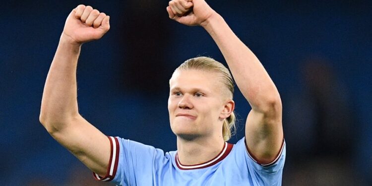 Manchester City's Norwegian striker Erling Haaland celebrates the title of "most goal in a single season" at the end of the English Premier League football match between Manchester City and West Ham at the Etihad Stadium in Manchester, north west England, on May 3, 2023. - Manchester City wins 3 - 0 against West Ham. (Photo by Oli SCARFF / AFP) / RESTRICTED TO EDITORIAL USE. No use with unauthorized audio, video, data, fixture lists, club/league logos or 'live' services. Online in-match use limited to 120 images. An additional 40 images may be used in extra time. No video emulation. Social media in-match use limited to 120 images. An additional 40 images may be used in extra time. No use in betting publications, games or single club/league/player publications. /