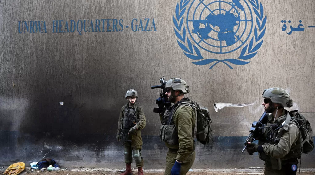 Israeli soldiers operate next to the UNRWA headquarters, amid the ongoing conflict between Israel and the Palestinian Islamist group Hamas, in the Gaza Strip, February 8, 2024. REUTERS/Dylan Martinez EDITOR'S NOTE: REUTERS PHOTOGRAPHS WERE REVIEWED BY THE IDF AS PART OF THE CONDITIONS OF THE EMBED. NO PHOTOS WERE REMOVED     TPX IMAGES OF THE DAY