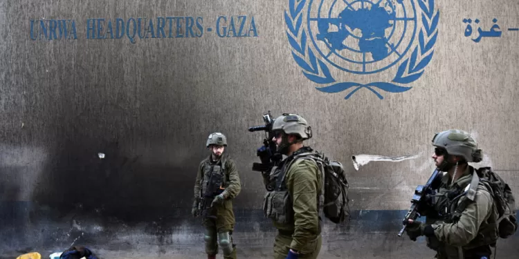Israeli soldiers operate next to the UNRWA headquarters, amid the ongoing conflict between Israel and the Palestinian Islamist group Hamas, in the Gaza Strip, February 8, 2024. REUTERS/Dylan Martinez EDITOR'S NOTE: REUTERS PHOTOGRAPHS WERE REVIEWED BY THE IDF AS PART OF THE CONDITIONS OF THE EMBED. NO PHOTOS WERE REMOVED     TPX IMAGES OF THE DAY