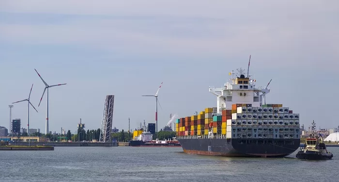 Huge container ships being loaded with cranes in Antwerp container terminal